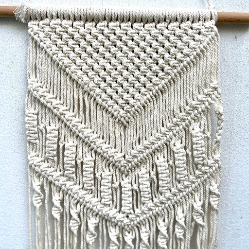 Macrame Wall Hanging DécorHandmade macramé wall hanging.
Size: Macrame 14" Width X 29" Length (from top to the ends of longest fringe)
Wood dowel: 17"Macrame Wall Hanging