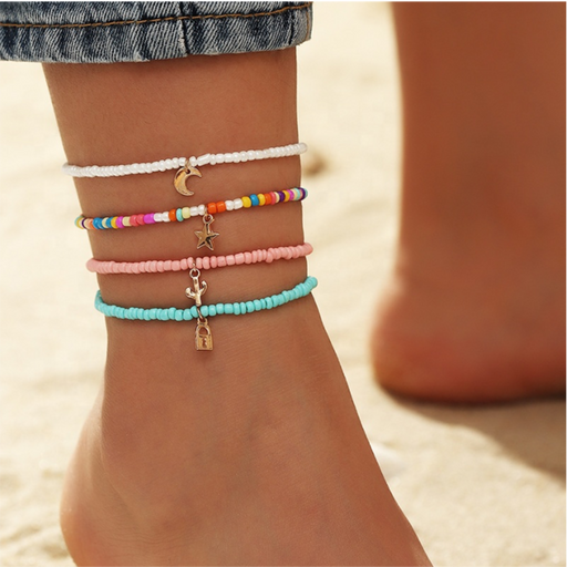 Beaded Anklet Set
Set of four beaded anklets with colorful beads and a gold charm. Beaded Anklet Set