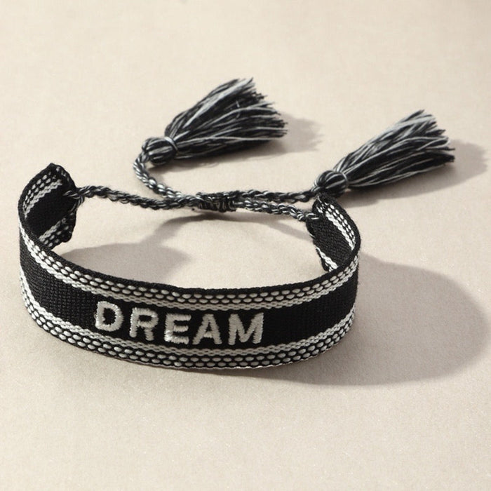 Dream BraceletHandmade tassel bracelet with woven letter embroidery.Dream Bracelet