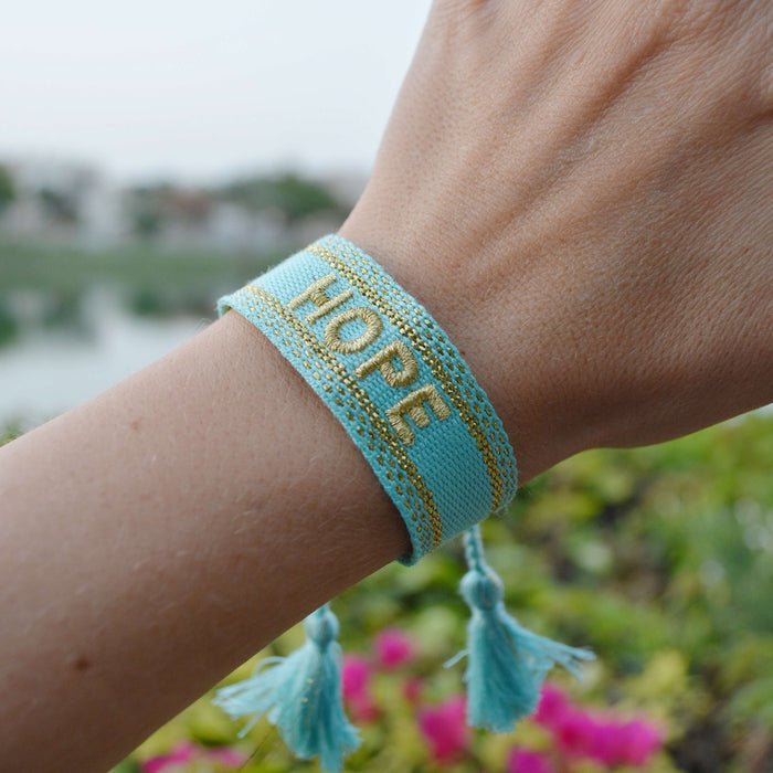 Hope BraceletHandmade tassel bracelet with woven letter embroidery.Hope Bracelet