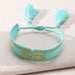 Hope BraceletHandmade tassel bracelet with woven letter embroidery.Hope Bracelet