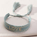 Love Bracelet
Handmade adjustable bracelet with woven letter embroidery. 
Love Bracelet
