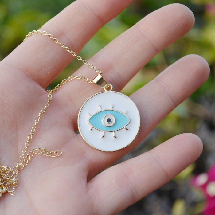 Evil Eye Necklace
Gold coloured necklace with enamel evil eye pendant in white or blue.Evil Eye Necklace